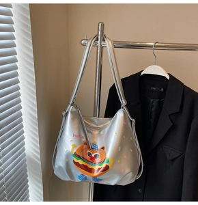 Close-up of cute cartoon hamburger print on silver matte leather large tote backpack