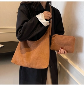 Brown suede hobo bucket bag set with matching pouch and adjustable shoulder strap
