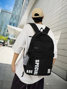 Black high-capacity fashion backpack with white SPECIAL lettering for outdoor urban use