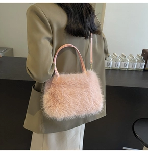 Detail of soft pink faux fur tote bag with long fluffy texture and slender shoulder strap