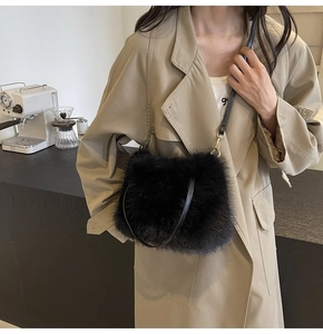 Detail of black faux fur texture and slim leather strap on this stylish crossbody bag