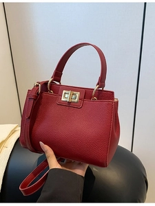 Elegant dark red trapezoid leather handbag with gold twist lock for women