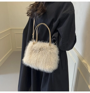 Detail of fluffy faux fur tote bag showing plush texture and metallic hardware