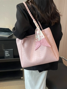 Pink large tote bag with houndstooth texture and stylish woven handle for daily commute