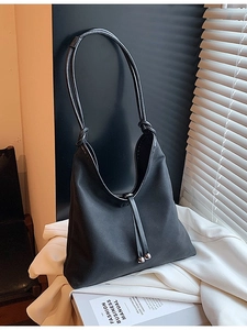 Minimalist black large capacity hobo shoulder bag with knot detail and silver charms