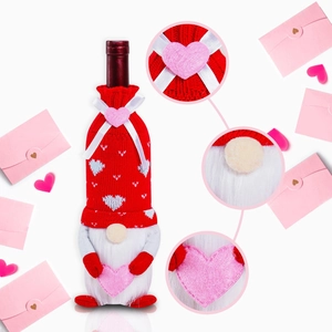 Red faceless gnome wine bottle cover with heart pattern for Valentine's Day decor