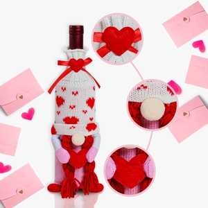 Macro detail of knitted gnome wine bottle cover with heart patterns and braided pigtails
