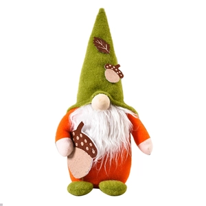 Autumn harvest gnome plush with orange body holding an acorn for Thanksgiving decor