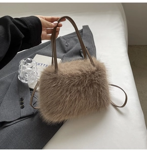 Detailed texture of fluffy khaki faux fur handbag with elegant brown leather handle