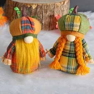 Pair of autumn gnomes with pumpkin hats and plaid shirts for Thanksgiving decor