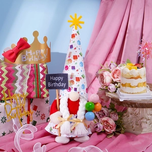 Plush birthday gnome doll with Happy Birthday sign and balloons on a festive background