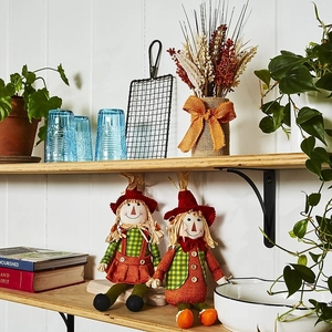 Sitting autumn scarecrow doll set with plaid fabric and straw hair for harvest decor