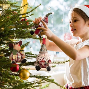 Christmas plush ornaments with plaid pattern featuring Santa, elk, and snowman on a tree