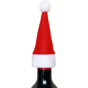 Mini Christmas hat bottle topper made of red non-woven fabric with white plush trim