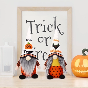 Halloween faceless gnome plush dolls with Trick or Treat hat on wooden table decor
