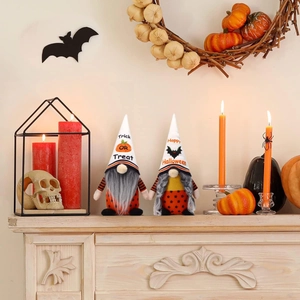 Detail of Halloween gnomes with Trick or Treat and Happy Halloween prints on fireplace