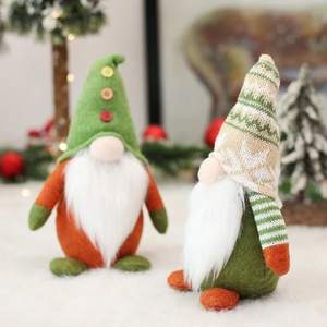 Detail of Christmas gnomes with knitted hats and white beards on festive snow background