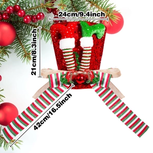 Sparkly red sequin Christmas tree topper with striped elf legs and bow decoration