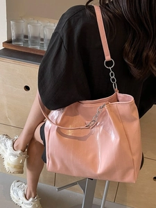 Pink crocodile pattern tote bag with silver chain straps for casual daily commuting