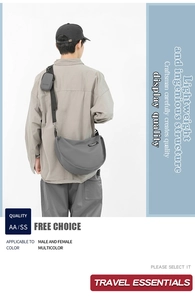 Detail of grey nylon crescent crossbody bag with mini pouch and MULIDI logo label