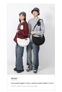 Medium capacity nylon crossbody bag with adjustable wide strap and small coin pouch detail