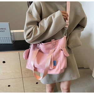 Pink large capacity canvas tote bag with adjustable shoulder strap and side pouches