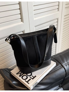 Vintage black bucket bag in patchwork suede and smooth leather with gold hardware