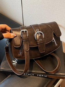 Retro dark brown leather saddle bag with silver buckle and adjustable shoulder strap