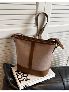 Vintage suede patchwork bucket bag with adjustable leather strap and gold hardware