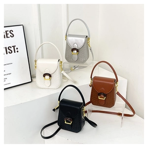 Detail of woven texture mini handbags in white silver brown and black colors