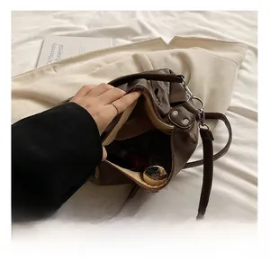 Interior view showing large capacity and zipper pocket of this brown vintage tote bag