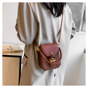 Brown vintage PU leather bag featuring woven texture and gold metal buckle detail