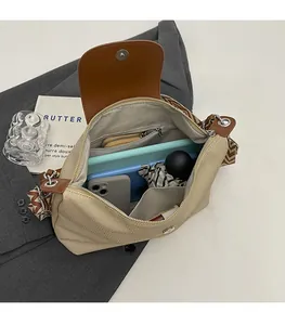 Interior view of beige tote bag showing spacious capacity for phone and cosmetics