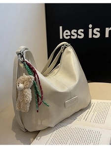 Creamy white large Hobo bag with plush bear pendant and stylish decorative stitching