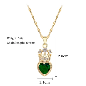 Detailed specs of gold crown necklace with green heart gem pendant and flat chain