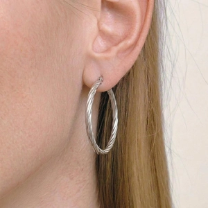 Twisted rope design hoop earrings in polished silver finish for a vintage chic look