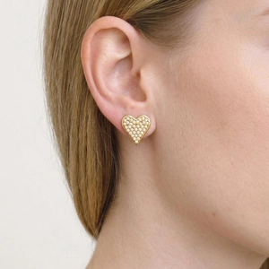 Minimalist 18K gold heart stud earrings with sparkling crystals worn by a model