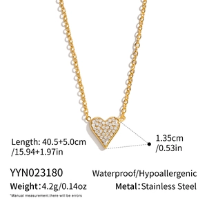 Detail of 18K gold plated heart necklace showing 40.5+5.0cm length and stainless steel texture