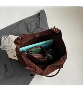 Interior view of spacious brown PU leather tote bag with magnetic clasp and inner pocket