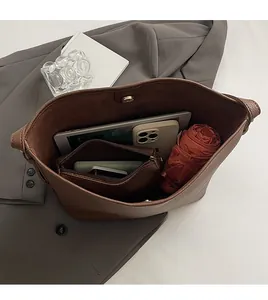 Deep brown litchi pattern leather tote bag interior with large storage capacity