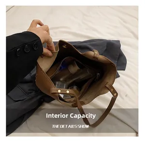 Internal capacity of the vintage brown tote showing spacious interior and zip pocket