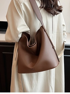 Brown large leather tote bag with pebble texture and matching wide shoulder strap