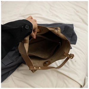 Interior view showing large capacity main compartment with zipper pocket and magnetic buckle