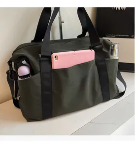 Detail view of large travel bag storage showing compartments for tablet and water bottle