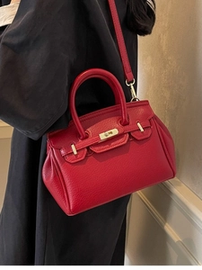 Classic red lychee leather handbag with gold lock and thin shoulder strap for women