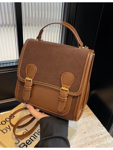 Retro brown dual-buckle satchel bag featuring textured faux leather and top handle