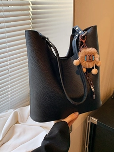 Vintage black lychee leather tote bag with a cute lion plush pendant for women