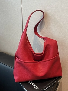 Minimalist deep red leather hobo tote bag with symmetrical front pockets for women