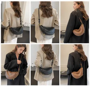 Multiple views of a textured leather crescent bag with knot straps and gold zipper