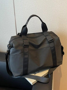 Large black waterproof sports duffel bag with COMCKNOC logo and adjustable strap